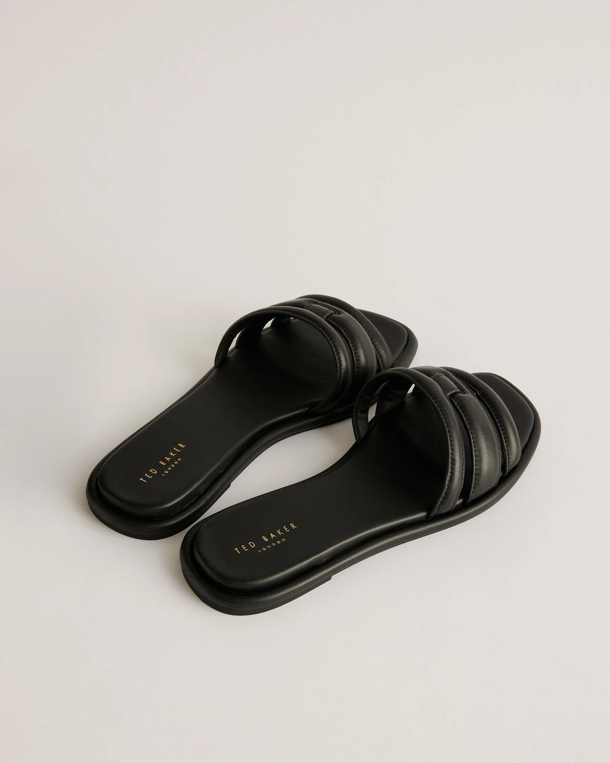 Leeiaa Flat Woven T Logo Slide Sandal Black